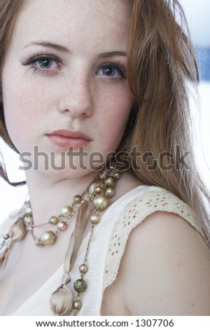 Girl With Red Hair And Freckles. stock photo : Portrait of a girl with freckles and long red hair.