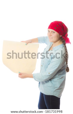 Young girl in a red scarf and a blue shirt stands with a roll of wallpaper in her hands and opens it.