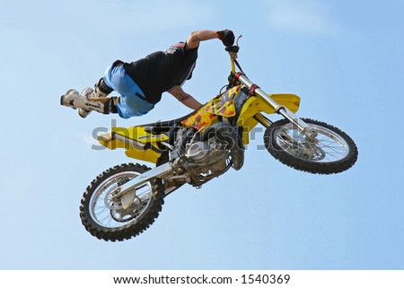 Motocross racer stunt.