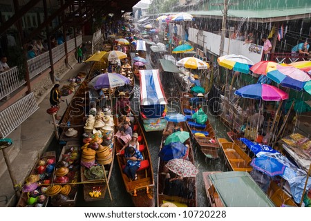 Traditional Asian floating market near Bangkok, Thailand.