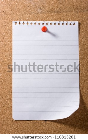 Blank sheet of note paper with a curled up corner, pinned to a cork bulletin board with red pushpin casting a long shadow. Ready for your text.