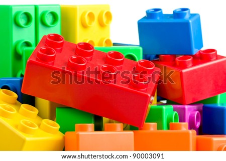 Colorful  toy plastic bricks in a heap