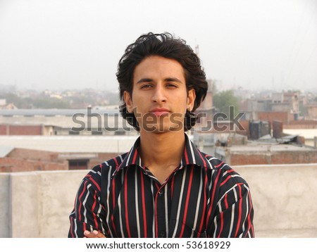 portrait of a young indian man smiling
