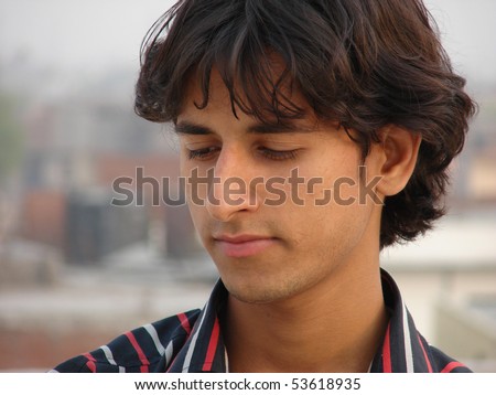 portrait of a young indian man looking with peace