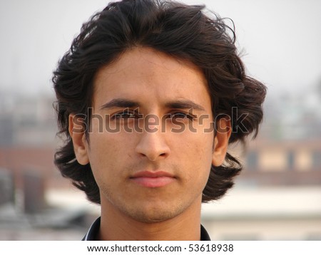 portrait of a young indian man looking with peace