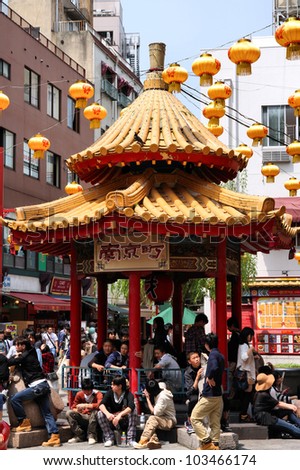 KOBE, JAPAN - APRIL 24: Visitors enjoy sunny weather in Chinatown station on April 24, 2012 in Kobe, Japan. Nankinmachi, Kobe\'s Chinatown is the 2nd largest in Japan and a popular tourism attraction.