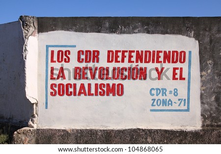 BARACOA, CUBA - FEBRUARY 12: Wall mural celebrates Revolution and Socialism on February 12, 2011 in Baracoa, Cuba. Cuban Revolution brought famous Fidel Castro to power in 1953.