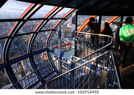 KYOTO, JAPAN - APRIL 14: Tourists visit Kyoto Tower on April 14, 2012 in Kyoto, Japan. Old Kyoto is a UNESCO World Heritage site and was visited by almost 1 million foreign tourists in 2010.