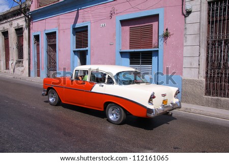 MATANZAS, CUBA - FEBRUARY 22: Man drives old American car on February 22, 2011 in Matanzas, Cuba. New change in law allows Cubans to trade cars. Cars in Cuba are very old because of the old law.