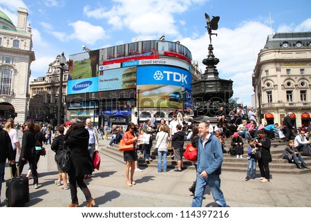 LONDON - MAY 13: Tourists visit Piccadilly Circus on May 13, 2012 in London. With more than 14 million international arrivals in 2009, London is the most visited city in the world (Euromonitor).
