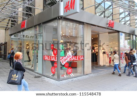 ESSEN, GERMANY - JULY 17: People visit H&M on July 17, 2012 in Essen. H&M is an international fashion retail corp known for its fast fashion approach. Founded in 1947, it employs 87,000 people (2011).