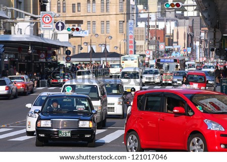 KYOTO, JAPAN - APRIL 17: Taxi driver works in heavy traffic on April 17, 2012 in Kyoto, Japan. With 589 vehicles per capita Japan is among most motorized countries worldwide which causes heavy traffic