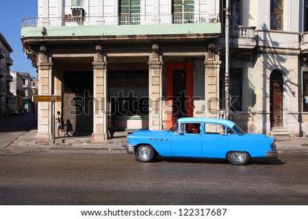 HAVANA - FEBRUARY 24: Cubans drive a Classic American car on February 24, 2011 in Havana. Recent change in law allows the Cubans to trade cars after it was forbidden for many years.