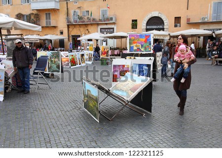 ROME - APRIL 9: Tourists visit Piazza Navona on April 9, 2012 in Rome. According to Euromonitor, Rome is the 3rd most visited city in Europe (5.5m international tourist arrivals 2009)