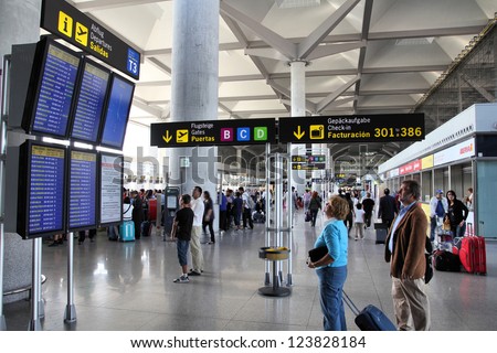 Malaga, Spain - October 14: Travelers Wait On October 14, 2010 At Malaga Airport, Spain. Malaga Is 4th Busiest Airport In Spain With 12.8 Million Passengers In 2011.