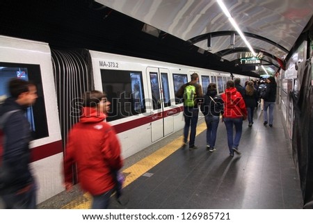 ROME - APRIL 8: Commuters walk in metro station on April 8, 2012 in Rome, Italy. Rome Metro has annual ridership of 331 million on its 2 lines. 3rd line is under construction (2012).