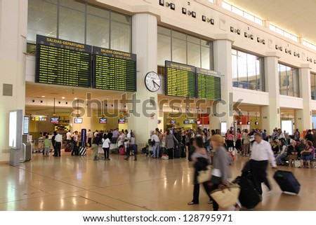 MALAGA, SPAIN - OCTOBER 14: Travelers wait on October 14, 2010 at Malaga Airport, Spain. Malaga is the 4th busiest airport in Spain with 12.6 million passengers in 2012.