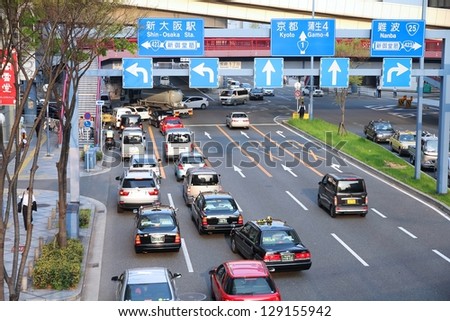Osaka, Japan - APRIL 24: Taxis drive in heavy traffic on April 24, 2012 in Osaka, Japan. With 589 vehicles per capita, Japan is among most motorized countries worldwide, which causes heavy traffic.