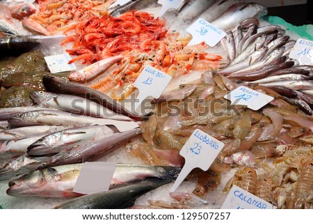 Fish market at Boqueria market in Barcelona, Spain. Fresh sea food.