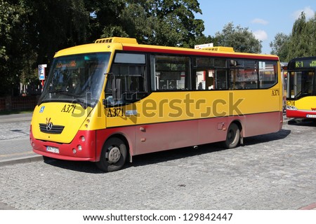 WARSAW, POLAND - SEPTEMBER 8: People ride Mercedes bus on September 8, 2010 in Warsaw, Poland. Mercedes Buses recently celebrated 100th anniversary of cooperation with Daimler Engines.