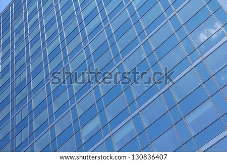 Modern architecture - skyscraper windows background texture. Modern office building in Paris, France.