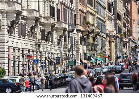 ROME - APRIL 8: Tourists visit old town street on April 8, 2012 in Rome. According to Euromonitor, Rome is the 3rd most visited city in Europe (5.5m international tourist arrivals 2009)