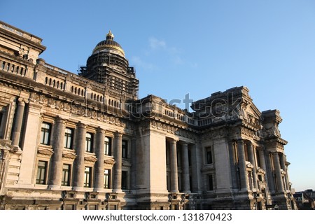 Monumental architecture landmark in Brussels, Belgium. Justice Palace (Palais de Justice). Eclectic and neoclassical style building in sunset light.