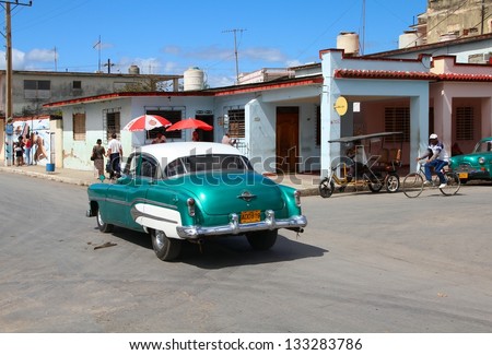 MORON, CUBA - FEBRUARY 19: Cuban drives old car on February 19, 2011 in Moron, Cuba. Recent change in law allows the Cubans to trade cars again. Most cars in Cuba are very old because of the old law.