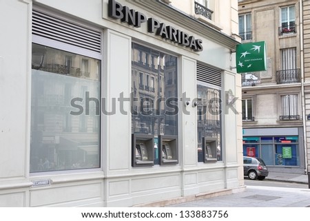 PARIS - JULY 24: BNP Paribas Bank branch on July 24, 2011 in Paris, France. Formed through merger in 2000, the bank is currently largest worldwide by assets ($2.68 trillion USD).
