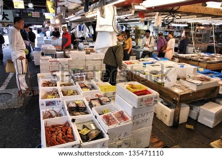 TOKYO - MAY 11: Shoppers visit Tsukiji Fish Market on May 11, 2012 in Tokyo. It is the biggest wholesale fish and seafood market in the world.