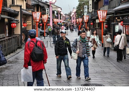 KYOTO, JAPAN - APRIL 16: Tourists walk on April 16, 2012 in Kyoto, Japan. Old Kyoto is a UNESCO World Heritage site and was visited by almost 1 million foreign tourists in 2010.