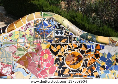 BARCELONA, SPAIN - SEPTEMBER 11: Floral mosaic in Park Guell on September 11, 2009 in Barcelona, Spain. It was designed by famous Antonio Gaudi. Barcelona is the most visited city in Spain.