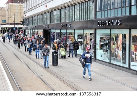 MANCHESTER, UK - APRIL 22: People visit shopping area on April 22, 2013 in Manchester, UK. Greater Manchester is the 3rd most populous urban area in the UK (2.2 million people).