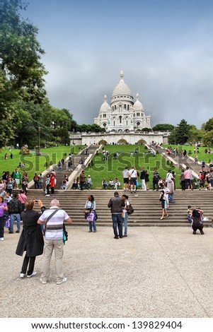 PARIS - JULY 22: Tourists stroll in Montmartre district on July 22, 2011 in Paris, France. Monmartre area is popular among tourists in Paris, the most visited city worldwide.