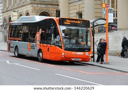 Manchester, Uk - April 22: People Board Free Metroshuttle City Bus On April 22, 2013 In Manchester, Uk. Greater Manchester Is Uk\'S 2nd Largest Population Center With 2.5 Million Inhabitants.