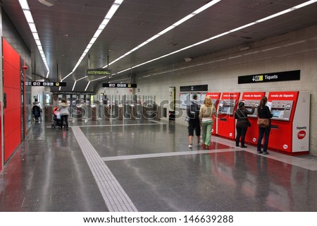 BARCELONA, SPAIN - NOVEMBER 6: People enter Metro station on November 6, 2012 in Barcelona, Spain. Barcelona has the 2nd busiest subway system in Spain with 448m annual rides (2012).