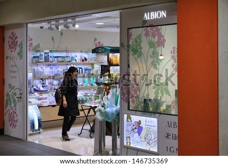 TOKYO - APRIL 13: Shopper visits Albion cosmetics store on April 13, 2012 in Tokyo. Albion exists since 1956 and employs 2,950 people as of 2013.