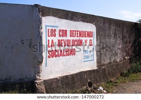 BARACOA, CUBA - FEBRUARY 12: Wall mural celebrates Revolution and Socialism on February 12, 2011 in Baracoa, Cuba. Cuban Revolution brought famous Fidel Castro to power in 1953.