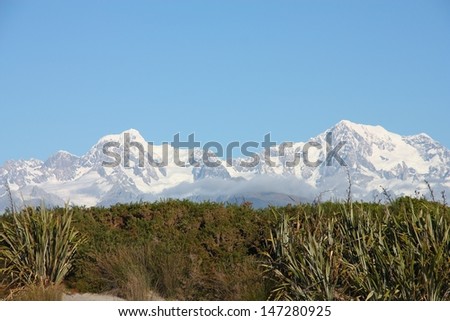 New Zealand. Mountain landscape including Aoraki Mt. Cook and Mt. Tasman of Southern Alps. Snowcapped mountains.