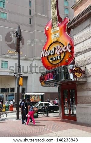 PHILADELPHIA - JUNE 11: People walk past Hard Rock Cafe on June 11, 2013 in Philadelphia. There are 175 Hard Rock locations in 53 countries.