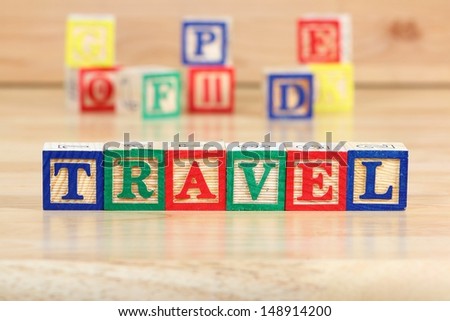 Wooden blocks with letters. Children educational toy concept - travel with kids.