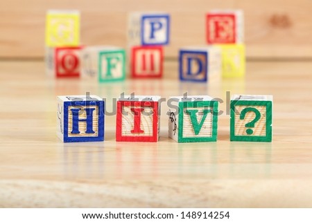 Wooden blocks with letters. Children educational toy concept - HIV and AIDS education.