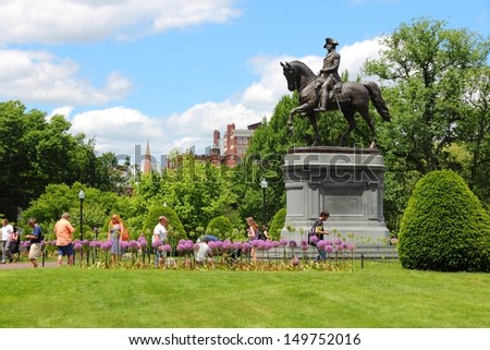 BOSTON - JUNE 9: People visit George Washington statue in famous Public Garden on June 9, 2013 in Boston. Public Garden dates back to 1837 and is a registered monument.