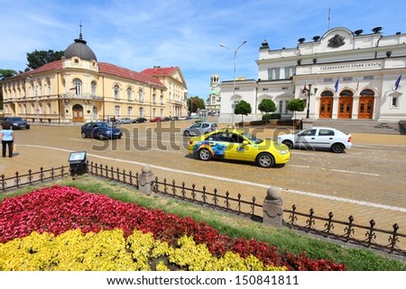 SOFIA, BULGARIA - AUGUST 17: People drive in front of National Assembly on August 17, 2012 in Sofia, Bulgaria. Bulgaria has 393 vehicles per capita. The number has grown fast in recent years.