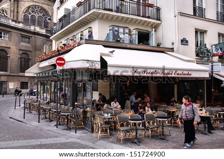 Paris - July 20: People Visit Cafe La Pointe Saint Eustache On July 20, 2011 In Paris, France. The Cafe Is A Typical Establishment For Paris, One Of Largest Metropolitan Areas In Europe.