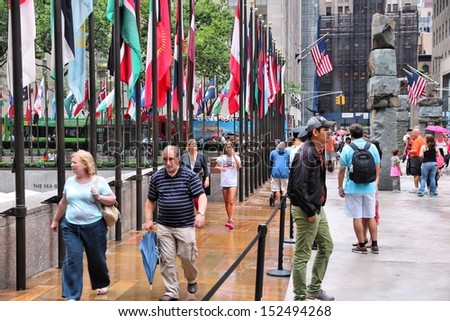 NEW YORK - JULY 1: People visit Rockefeller Center on July 1, 2013 in New York. Rockefeller Center is one of most recognized landmarks in the United States and is a National Historic Landmark.