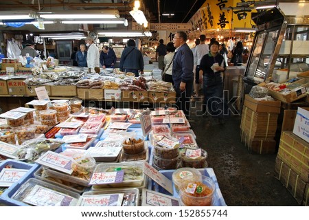 TOKYO - MAY 11: People visit famous Tsukiji Fish Market on May 11, 2012 in Tokyo. It is the biggest wholesale fish and seafood market in the world.