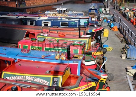 BIRMINGHAM, UK - APRIL 19: Narrowboats moored at Gas Street Basin on April 19, 2013 in Birmingham, UK. Birmingham is the 2nd most populous British city. It has rich waterway and boat culture.