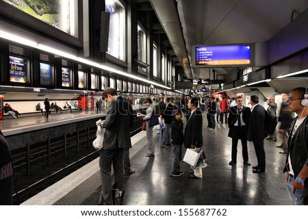 PARIS - JULY 20: People wait at Metro station on July 20, 2011 in Paris, France. Paris Metro is the 2nd largest underground system worldwide by number of stations (300).