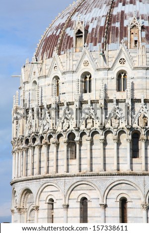 Pisa, Tuscany, Italy. Famous baptistery at Piazza Del Duomo. UNESCO World Heritage List landmark.